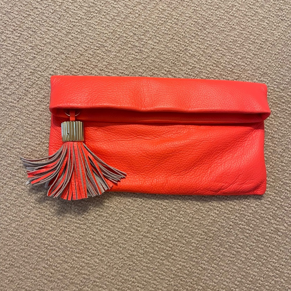India Hicks Carmen clutch in bright orange